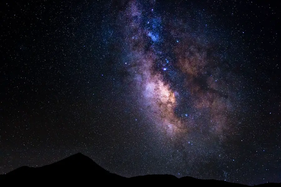 Silhouette of Mountain Under Starry Night